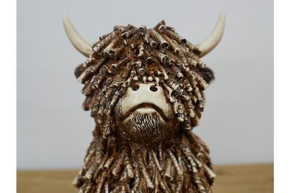 Medium Sitting Highland Cow