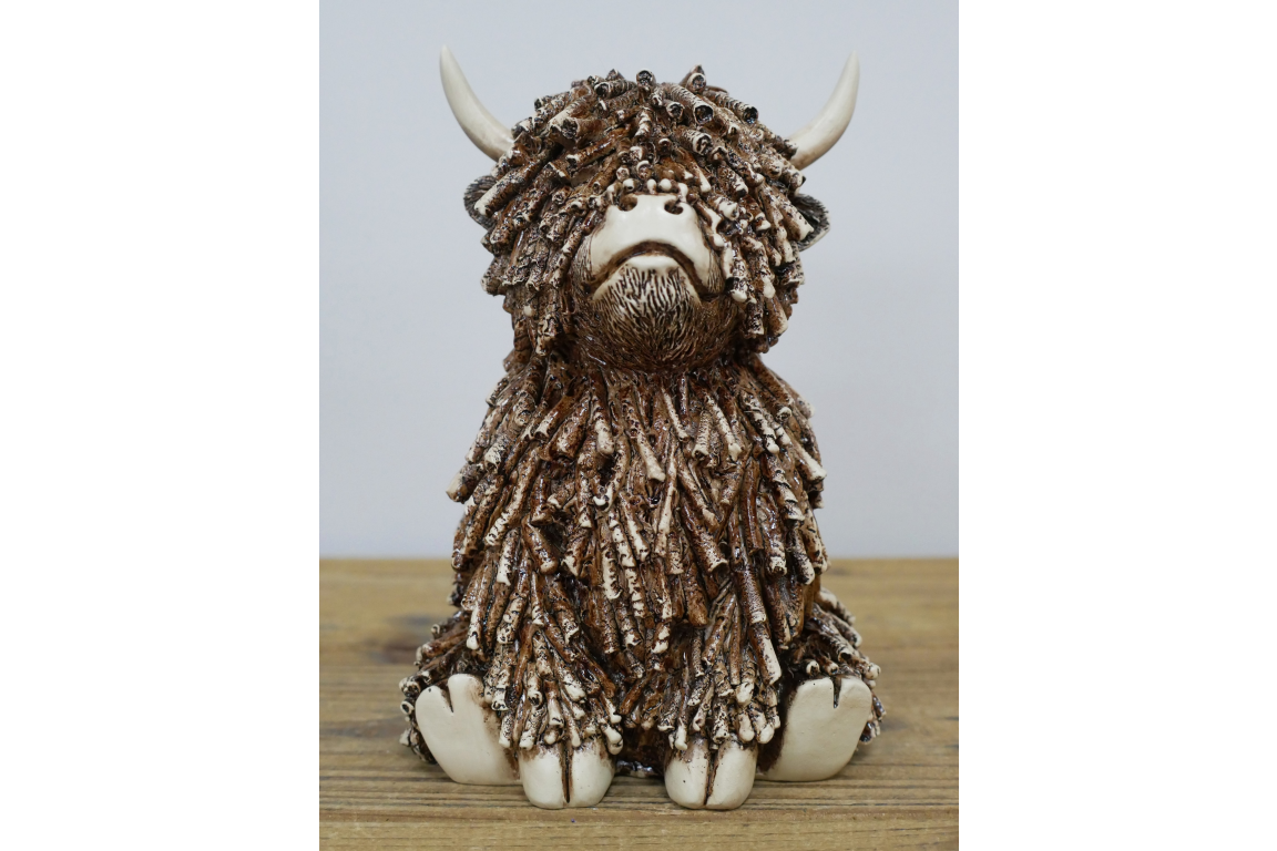 Medium Sitting Highland Cow