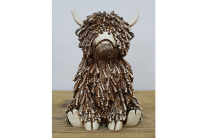 Medium Sitting Highland Cow