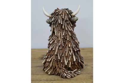 Medium Sitting Highland Cow