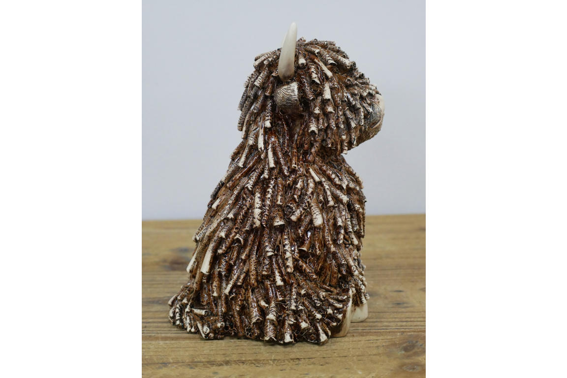 Medium Sitting Highland Cow