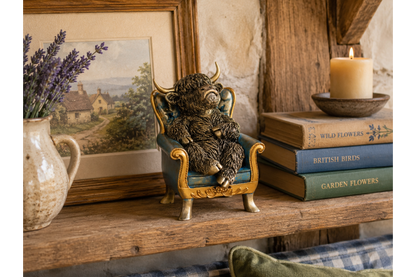 Highland Cow sat on chair