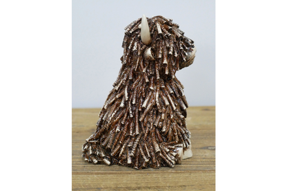 Sitting Shaggy Highland Cow